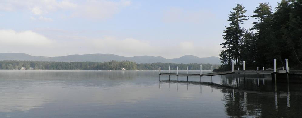 Morning on a Berkshire lake, with a dock and wooded hills